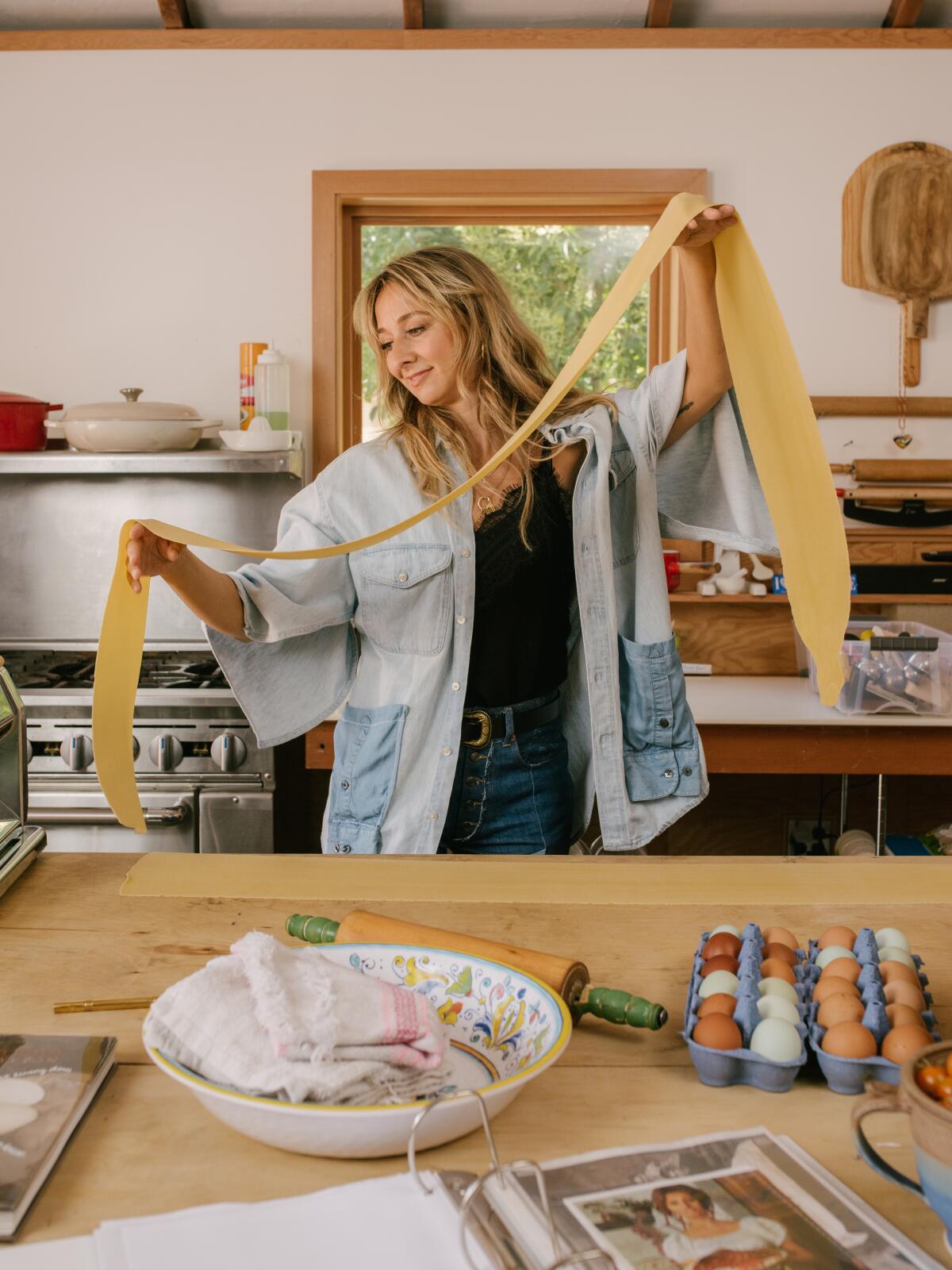 Courtney Storer makes pasta in her personal kitchen.