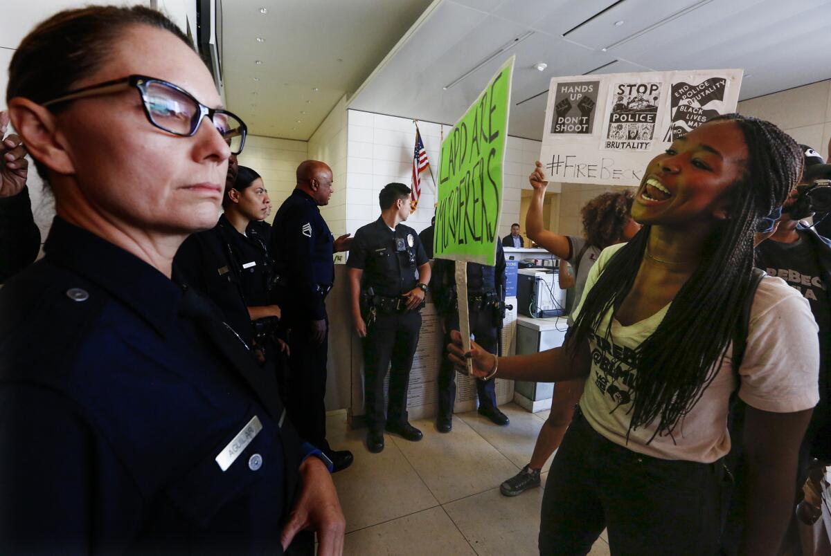 Community members protesting at LAPD headquarters over the death of Carnell Snell Jr.