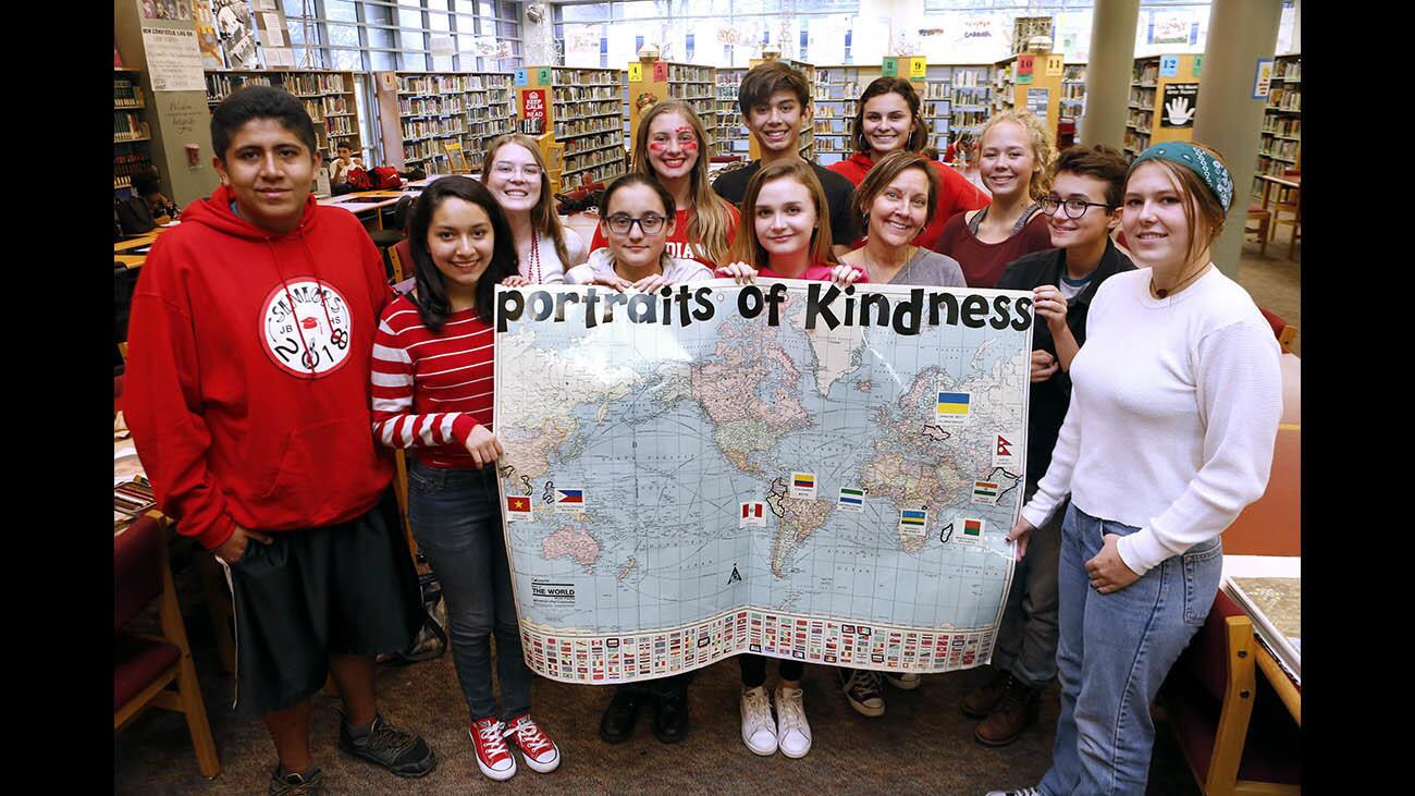 Photo Gallery: Burroughs High School students work on Portraits of Kindness project