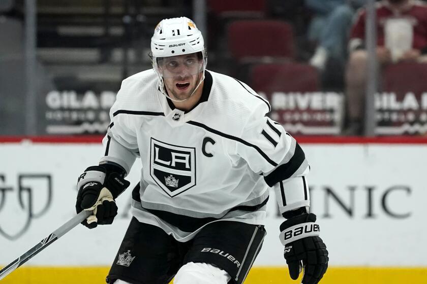 Los Angeles Kings center Anze Kopitar skates to the puck during the second period of an NHL hockey game against the Arizona Coyotes Monday, May 3, 2021, in Glendale, Ariz. (AP Photo/Ross D. Franklin)