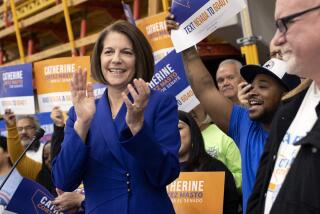 Sen. Catherine Cortez Masto, D-Nev., surrounded by supporters from local unions, speaks during a news conference celebrating her U.S. Senate race win, Sunday, Nov. 13, 2022, in Las Vegas. Cortez Masto beat Republican candidate Adam Laxalt, securing a Democratic majority in the U.S. Senate. (AP Photo/Ellen Schmidt)