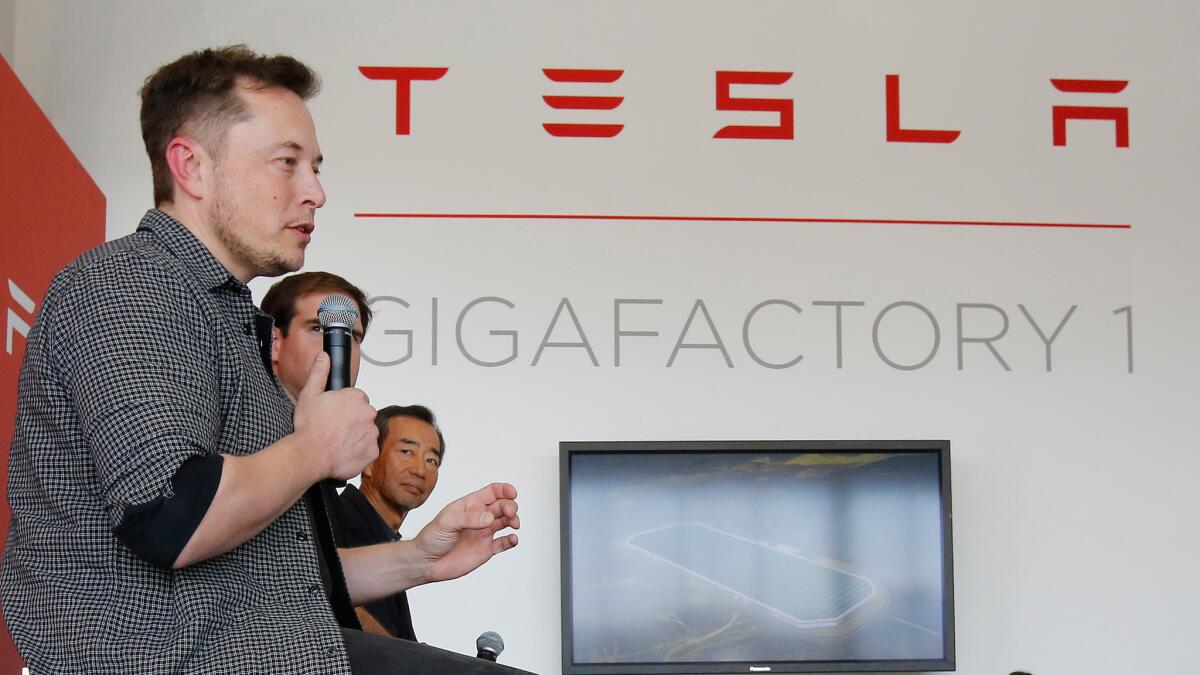 Elon Musk speaks at the recent grand opening of Tesla's Gigafactory 1. The Nevada battery production facility is still under construction.