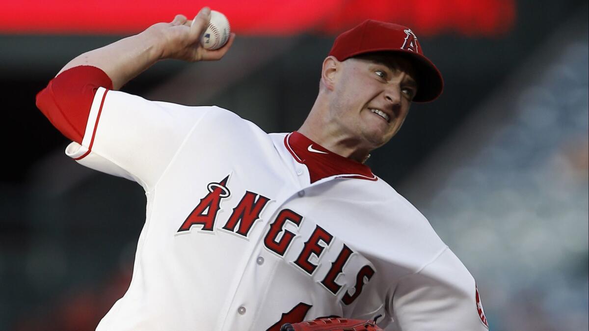 Bad for him, good for the cause of debunking stem cell hype: Angels pitcher Garrett Richards delivers one of his last pitches of the season against a Seattle Mariners batter Tuesday. Shortly afterward, he came off the mound and was scheduled for Tommy John surgery.