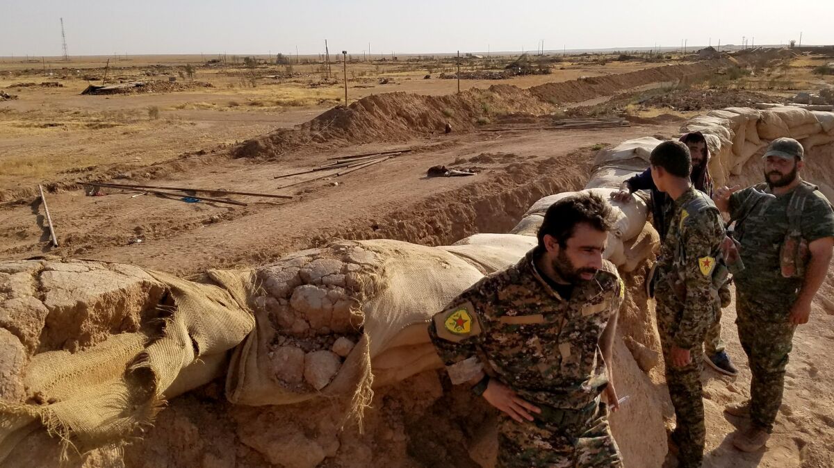 Commander Dilsoz Derek, 32, visits U.S.-backed People's Protection Unit (YPG) troops stationed at bases north of Dair Alzour in eastern Syria.