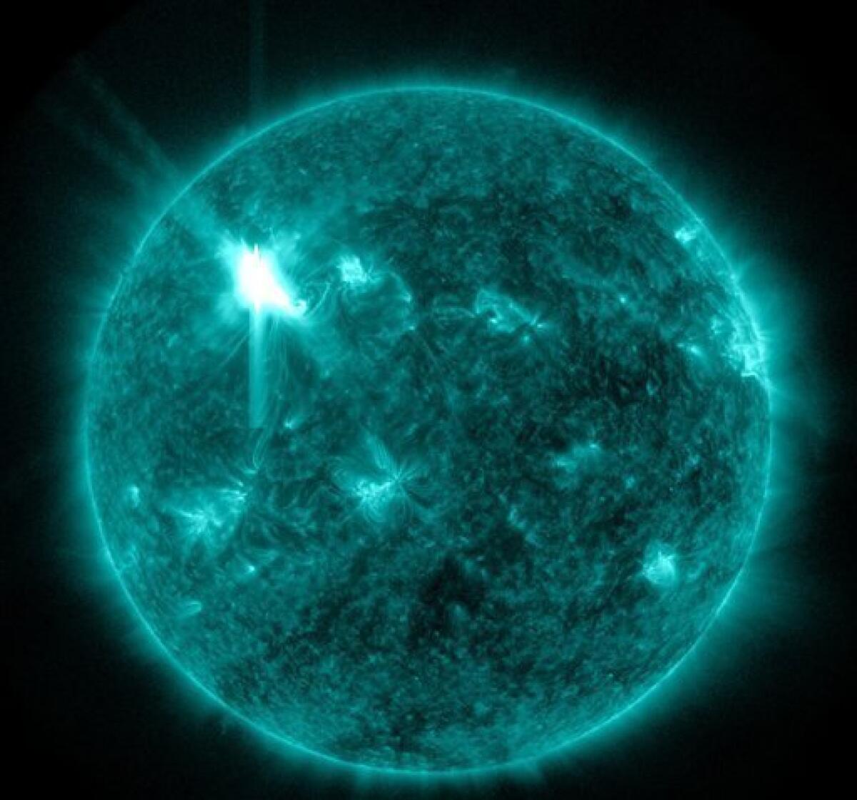 ADDS TIME THE FLARE OCCURRED - This extreme ultraviolet wavelength image provided by NASA shows a solar flare that erupted at 7 p.m. EST on Tuesday, March 6, 2012. An impressive solar flare is heading toward Earth and could disrupt power grids, GPS and airplane flights. Forecasters at the National Oceanic and Atmospheric Administration's (NOAA) Space Weather Prediction Center said the sun erupted Tuesday evening and the effects should start smacking Earth late Wednesday night, close to midnight EST. They say it is the biggest in five years and growing. (AP Photo/NASA)