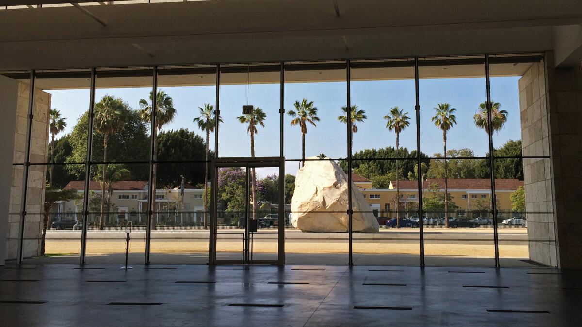 For three years, Michael Heizer's megalith sculpture "Levitated Mass" has sat in a specially designed courtyard at LACMA. But the best view of it is from indoors.