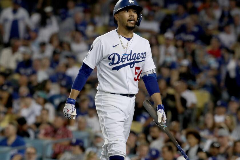 LOS ANGELES, CALIF. - AUG. 3, 2021. Dodgers second baseman Mookie Betts reacts after striking out against the Astros in the fith inning at Dodger Stadium on Tuesday, Aug. 3, 2021. The Astros cheated by stealing signals during the 2017 World Series against Dodgers. (Luis Sinco / Los Angeles Times)