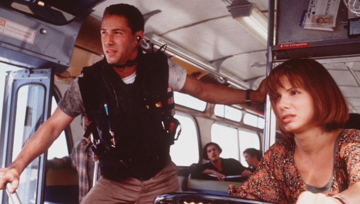 Keanu Reeves and Sandra Bullock in the 1994 bus thriller "Speed," a summer movie that still holds up.