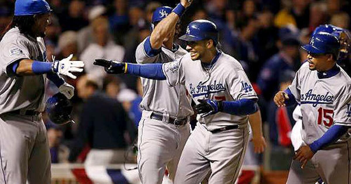 Boston Red Sox' Manny Ramirez swings for a grand slam during the