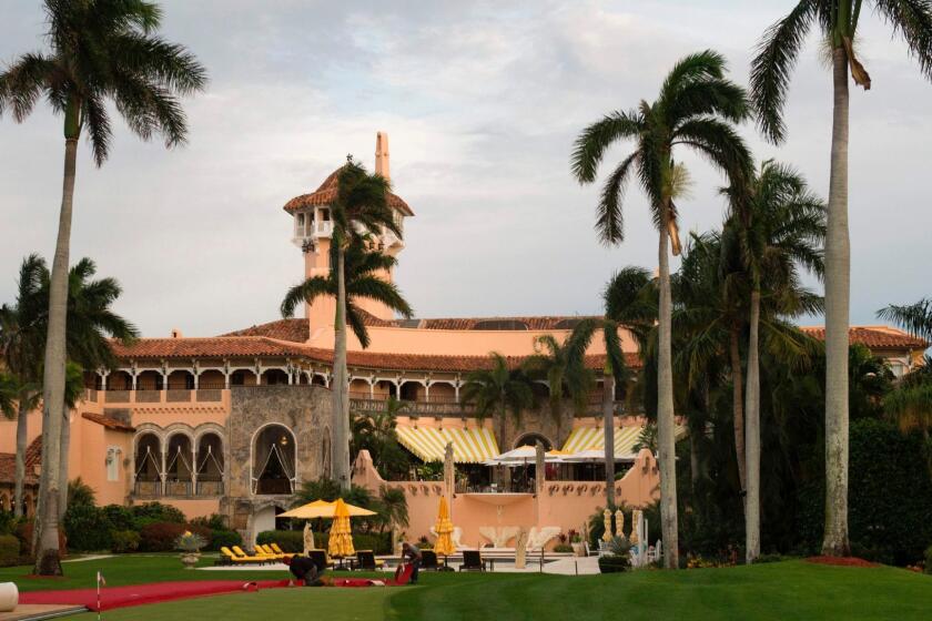 (FILES) This file photo taken on December 30, 2016 shows workers as they lay out the red carpet at Mar-a-Lago Club in Palm Beach, Florida. A US court has asked President Donald Trump's staff to turn over records of visitors to his Mar-a-Lago estate in Florida, according to a ruling made public on July 17, 2017. As president, Trump has visited his southern bolthole -- which he calls the "Winter White House" -- seven times between February and May when it closed for the season, according to an AFP tally. / AFP PHOTO / Don EMMERTDON EMMERT/AFP/Getty Images ** OUTS - ELSENT, FPG, CM - OUTS * NM, PH, VA if sourced by CT, LA or MoD **