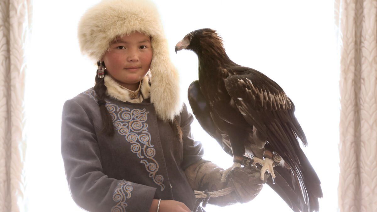 Aisholpan, star of the documentary "The Eagle Huntress, " became the first female from her Kazakh family to become an eagle hunter.