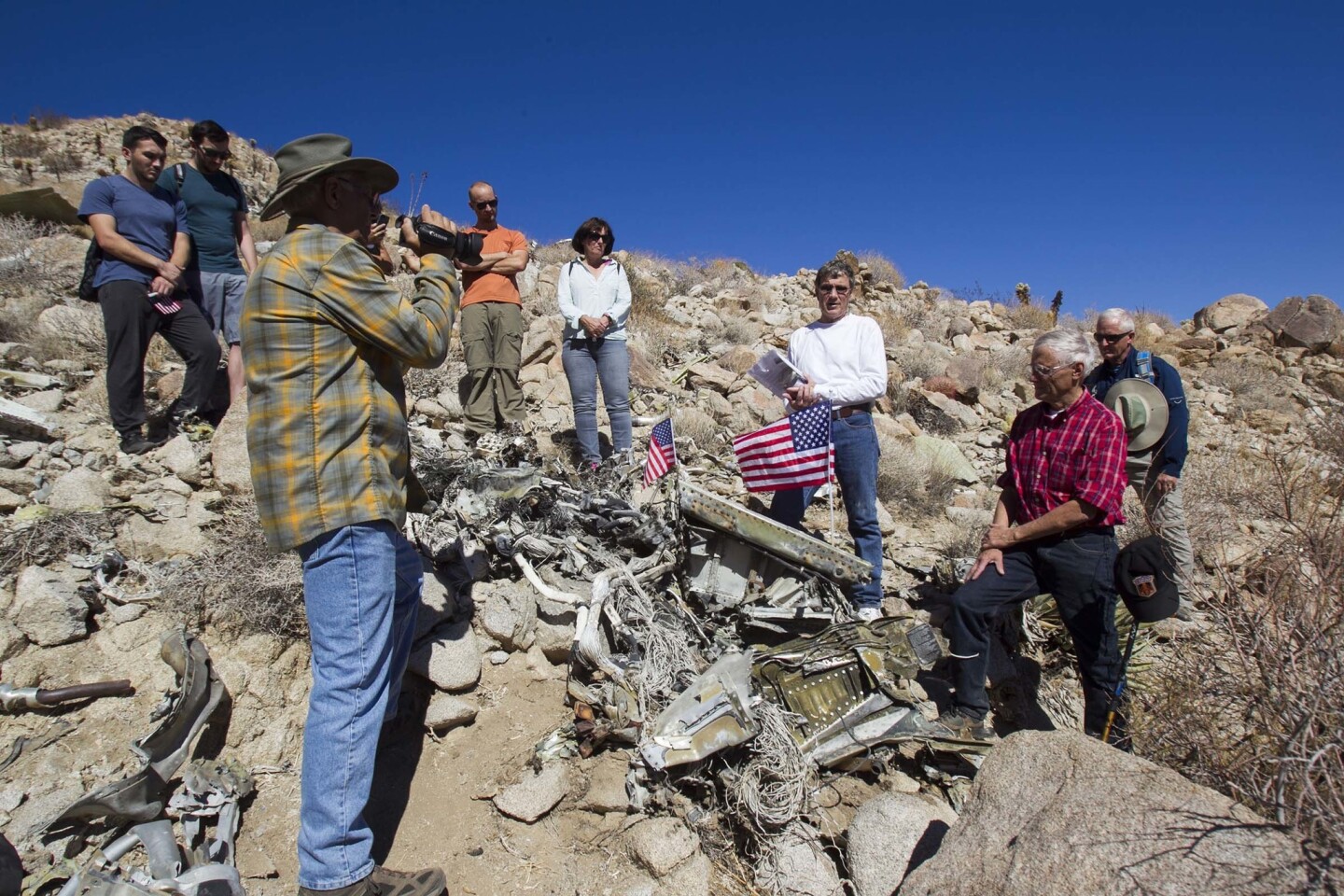 Bruce Guberman, with Project Remembrance, videotaped as the family haled a memorial at the exact time 50 years ago when the pilot crashed into the desert. The placed a lidded glass bottle amongst the wreckage so that if people come across the site while hiking they will have an idea of what happened there.