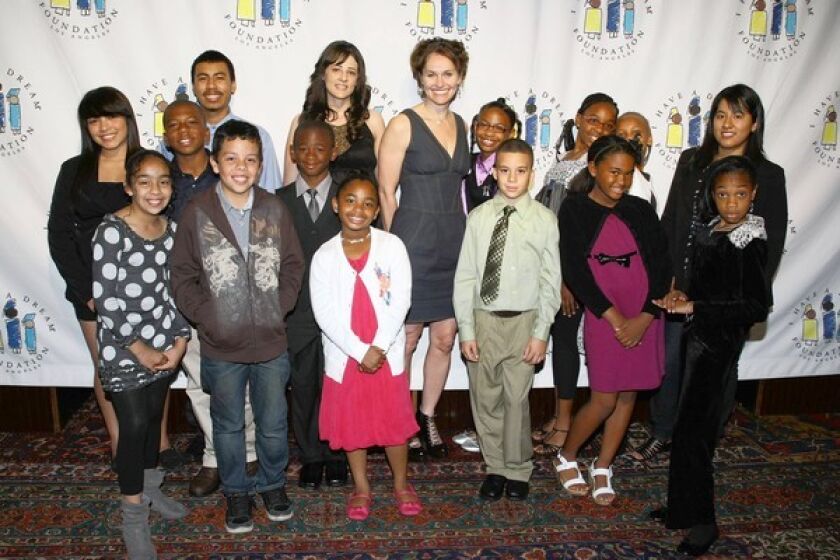 Amy Brenneman with participants in "I Have a Dream" Foundation-Los Angeles programs. Brenneman hosted the foundation's annual gospel brunch and fundraiser at the House of Blues.