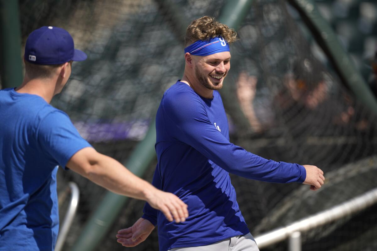 Dodgers second baseman Gavin Lux stretches before a game against the Colorado Rockies in July.