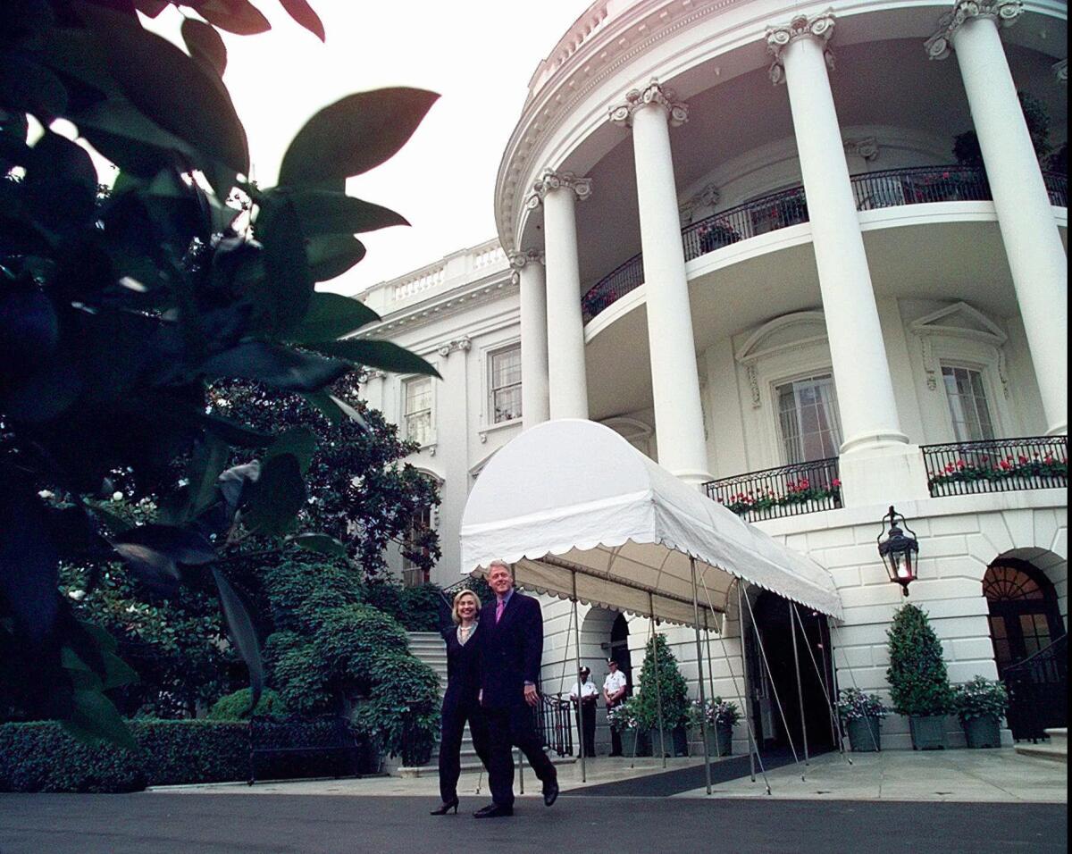 President Clinton and First Lady Hillary Rodham Clinton walk out of the White House in June 1997. Documents released Friday offer a peek at the sometimes-combative Clinton White House years.