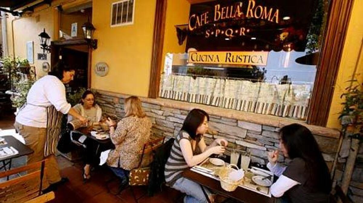 Bright butternut-yellow walls line the cheerful patio at Cafe Bella Roma, where most of the seating is outdoors.