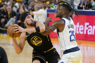Golden State Warriors guard Klay Thompson (11) is defended by Dallas Mavericks guard Reggie Bullock (25) during the first half in Game 5 of the NBA basketball playoffs Western Conference finals in San Francisco, Thursday, May 26, 2022. (AP Photo/Jeff Chiu)