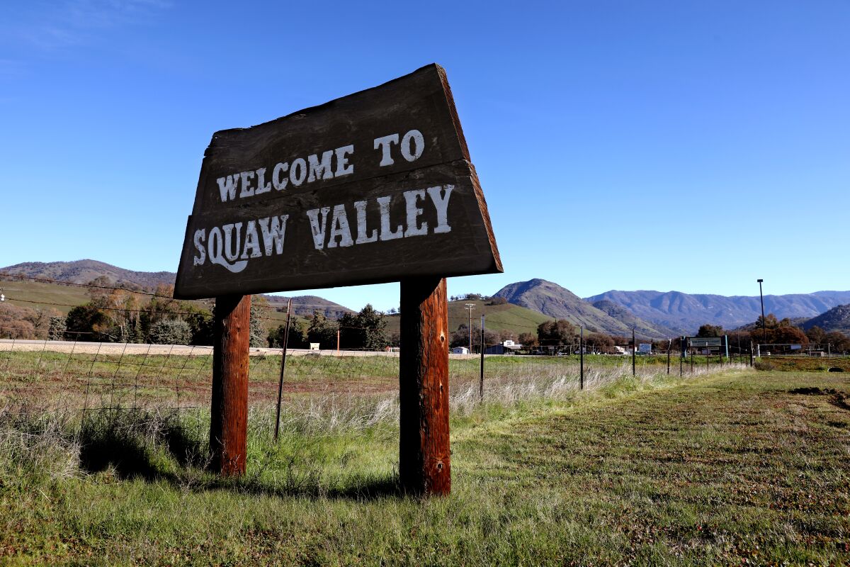 A "Welcome to Squaw Valley" sign along State Route 180.