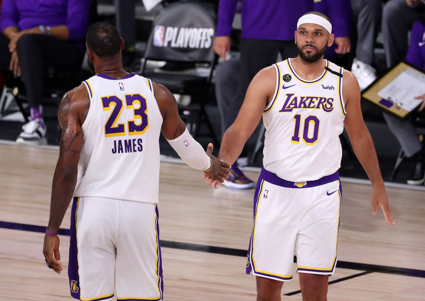LeBron James greets Lakers teammate Jared Dudley during an NBA playoff game Sept. 10, 2020.