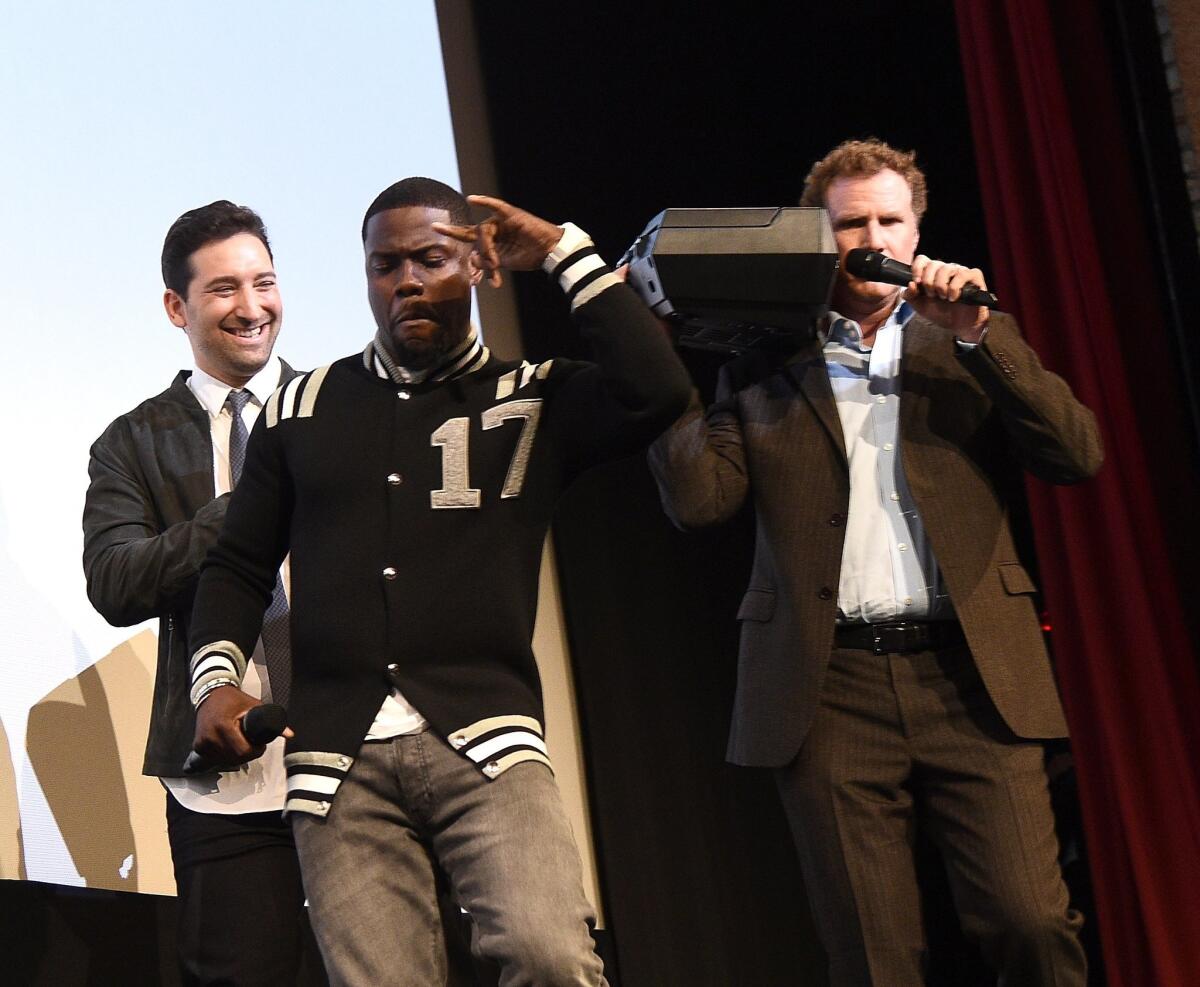 Director Etan Cohen, from left, Kevin Hart and Will Ferrell rev up the crowd at the SXSW premiere of "Get Hard."
