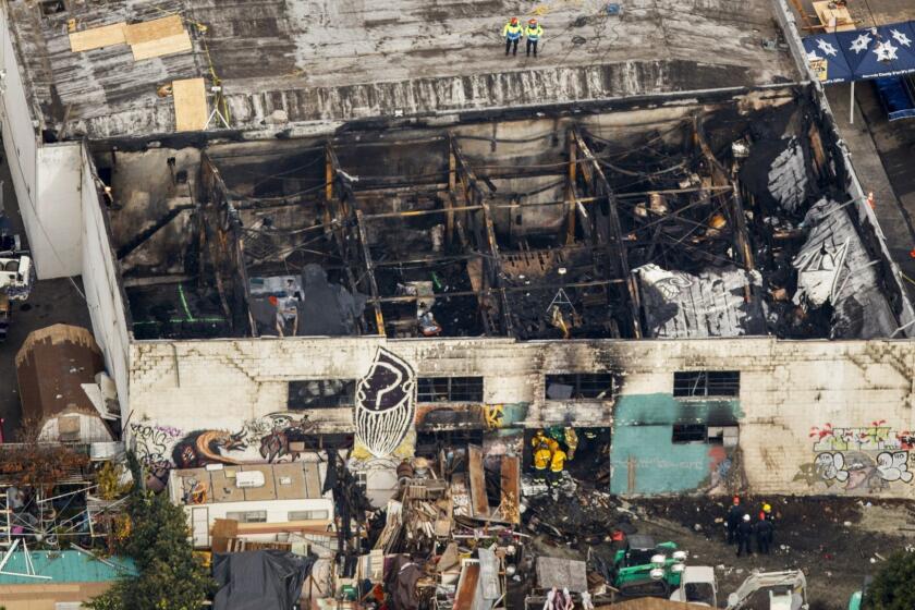 OAKLAND,CA --MONDAY, DECEMBER 05, 2016--An aerial view of the "Ghostship" warehouse that burned and killed at least 36 people in the Oakland, CA, neighborhood of Frutivale, Dec. 05, 2016. (Jay L. Clendenin / Los Angeles Times)
