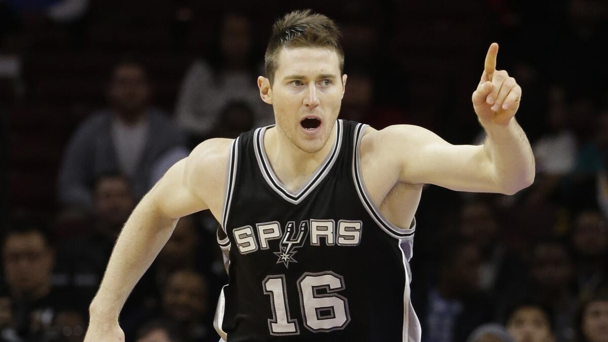 San Antonio Spurs center Aron Baynes gestures during a 109-103 victory over the Philadelphia 76ers on Monday.