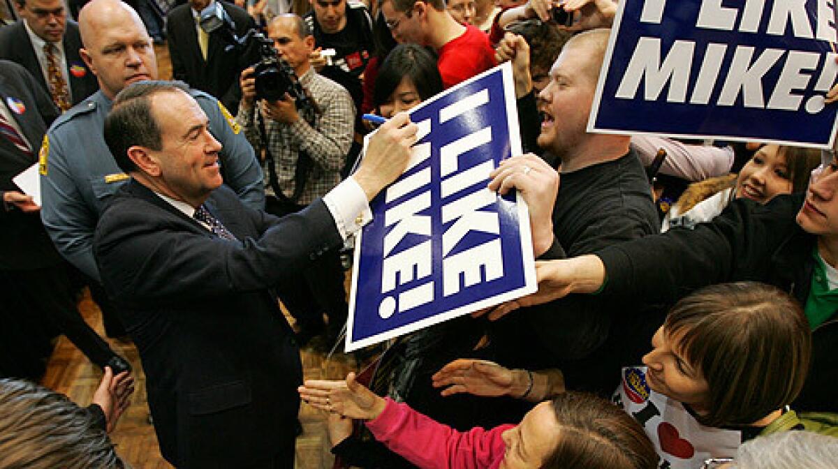 Republican presidential hopeful, former Arkansas Gov. Mike Huckabee greets students and supporters at a campaign rally at the University of Maryland in College Park, Md., Saturday, Feb. 9, 2008.