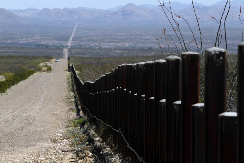 U.S. Customs and Border Patrol truck patrols the U.S. border with Mexico in Douglas, Ariz.