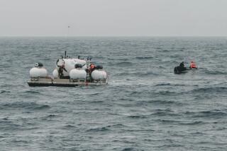 In this photo released by Action Aviation, the submersible Titan is prepared for a dive into a remote area of the Atlantic Ocean on an expedition to the Titanic on Sunday, June 18, 2023. Rescuers raced against time Tuesday, June 20, to find the missing submersible carrying five people, who were reported overdue Sunday night. (Action Aviation via AP)