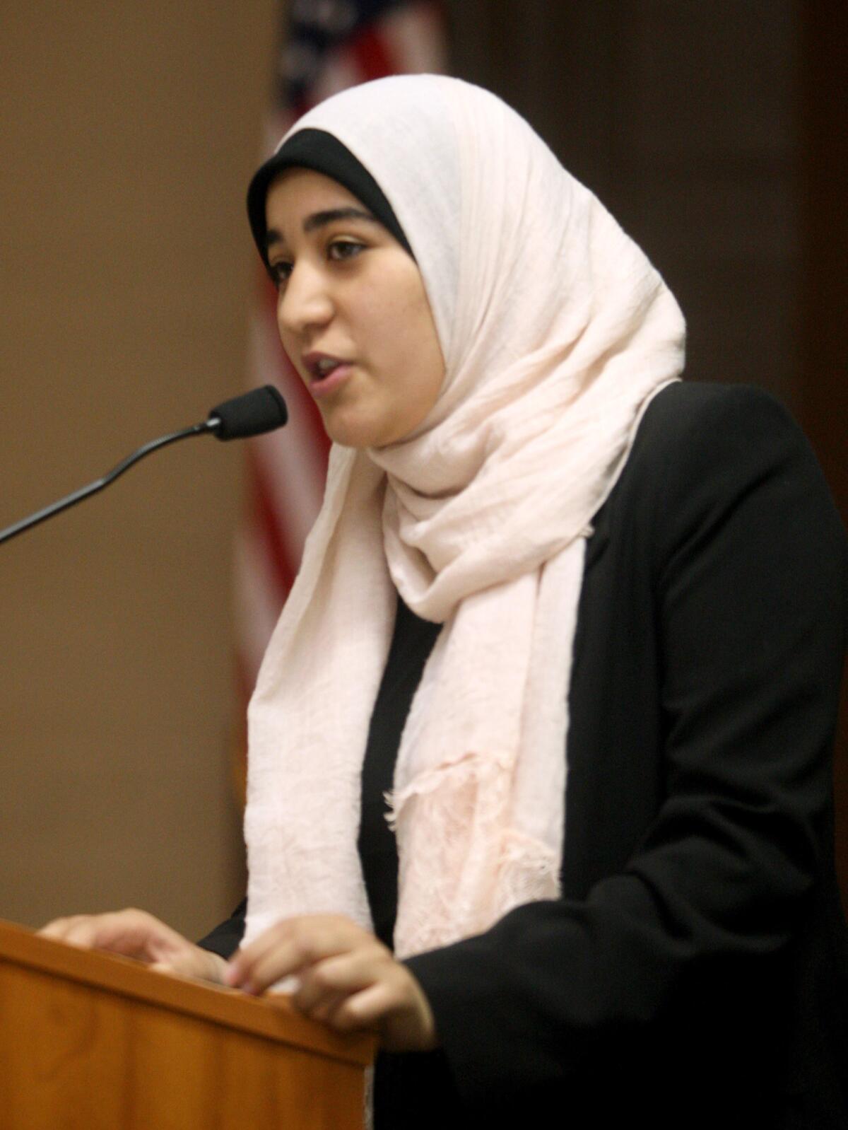 Fatimah Omar gives a spiritual reading from the Quran at the 53rd annual Glendale Mayor's Prayer Breakfast at the Glendale Civic Auditorium on Thursday, March 10, 2016.