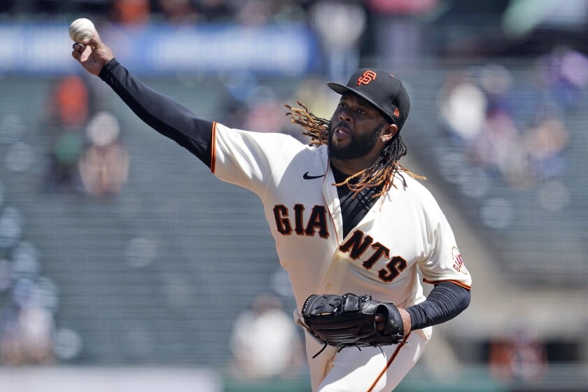 San Francisco Giants pitcher Johnny Cueto throws during the first inning of a baseball game against the Cincinnati Reds in San Francisco, Wednesday, April 14, 2021. (AP Photo/Jeff Chiu)