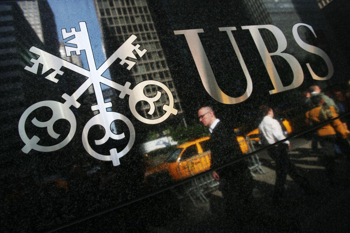 Swiss bank UBS said it is paying $545 million to settle U.S. cases of market manipulation.