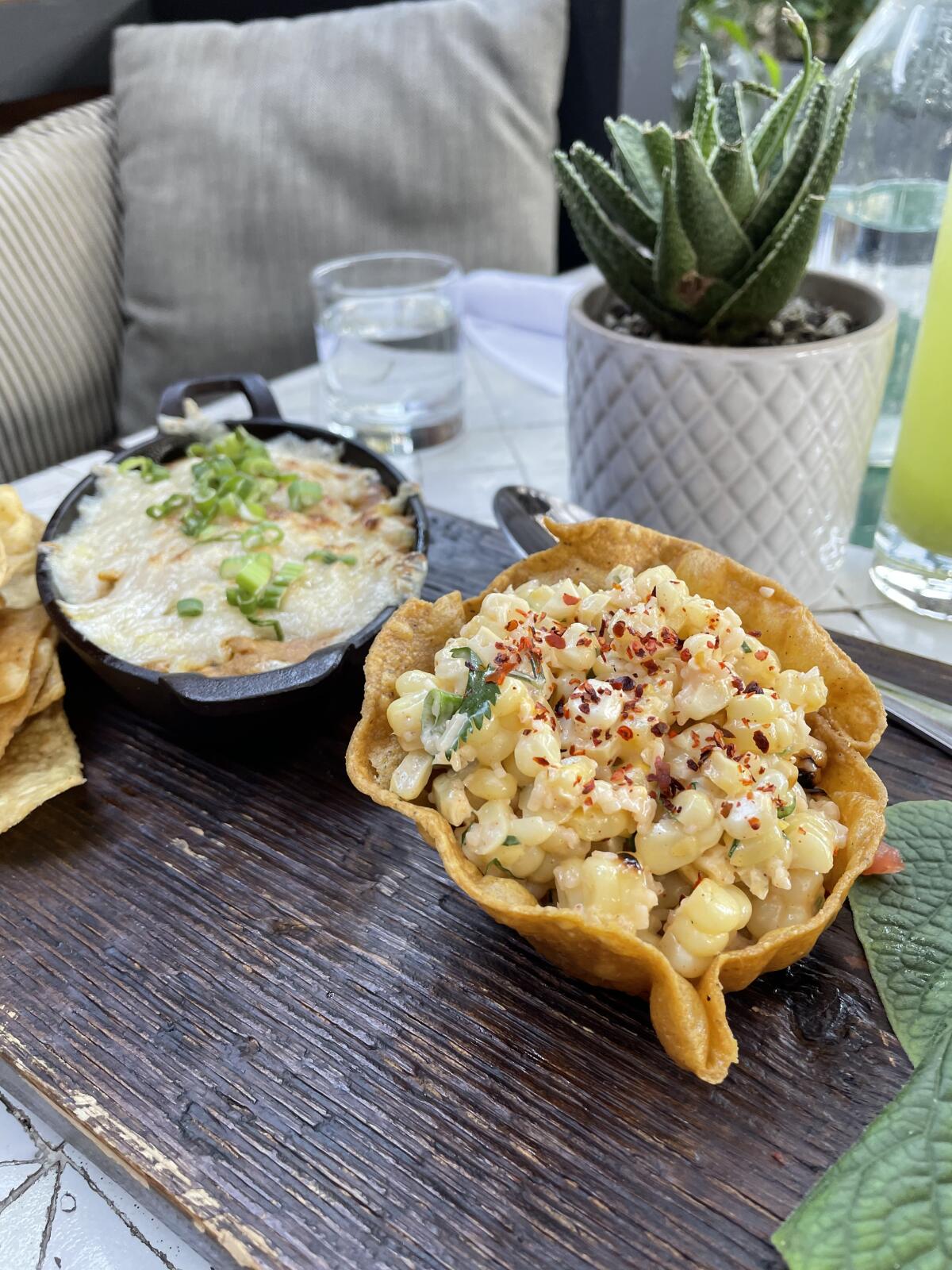 Queso fundido and grilled street corn, a pair of brunch offerings at Gracias Madre in Newport Beach.