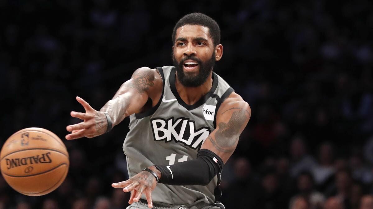 FILE - In this Jan. 14, 2020, file photo, Brooklyn Nets guard Kyrie Irving (11) .