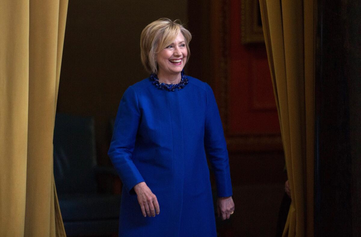 Democratic presidential candidate and former Secretary of State Hillary Rodham Clinton arrives at a recent speech at Columbia University in New York. Two recent polls differ in some respects regarding how voters view her.