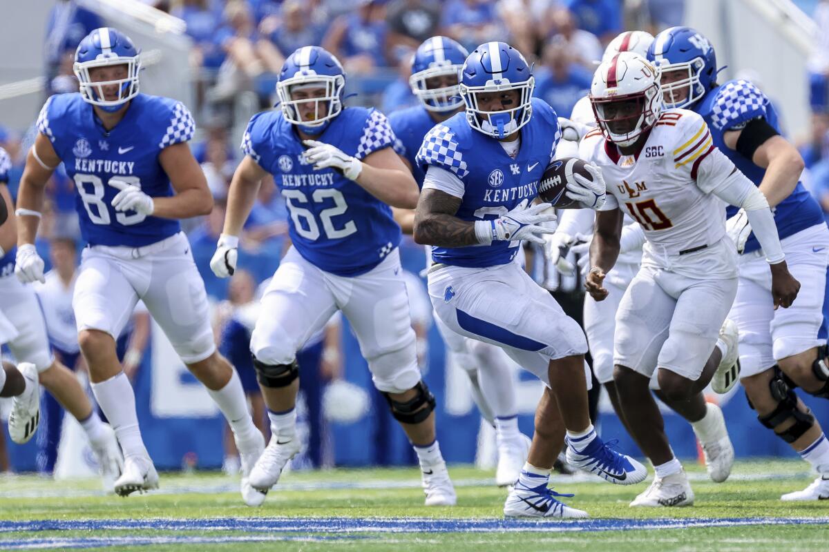 Kentucky running back Chris Rodriguez Jr. (24) runs the ball up the field during the second half of an NCAA college football game against Louisiana-Monroe in Lexington, Ky., Saturday, Sept. 4, 2021. (AP Photo/Michael Clubb)