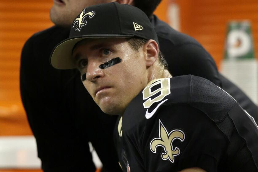 New Orleans Saints quarterback Drew Brees looks on during Sunday's loss to the Dallas Cowboys.