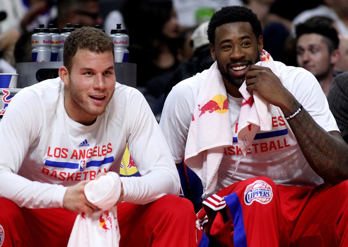 Blake Griffin and DeAndre Jordan enjoy the view from the bench as the Clippers cruise to a 114-86 win over the Orlando Magic on Wednesday night.