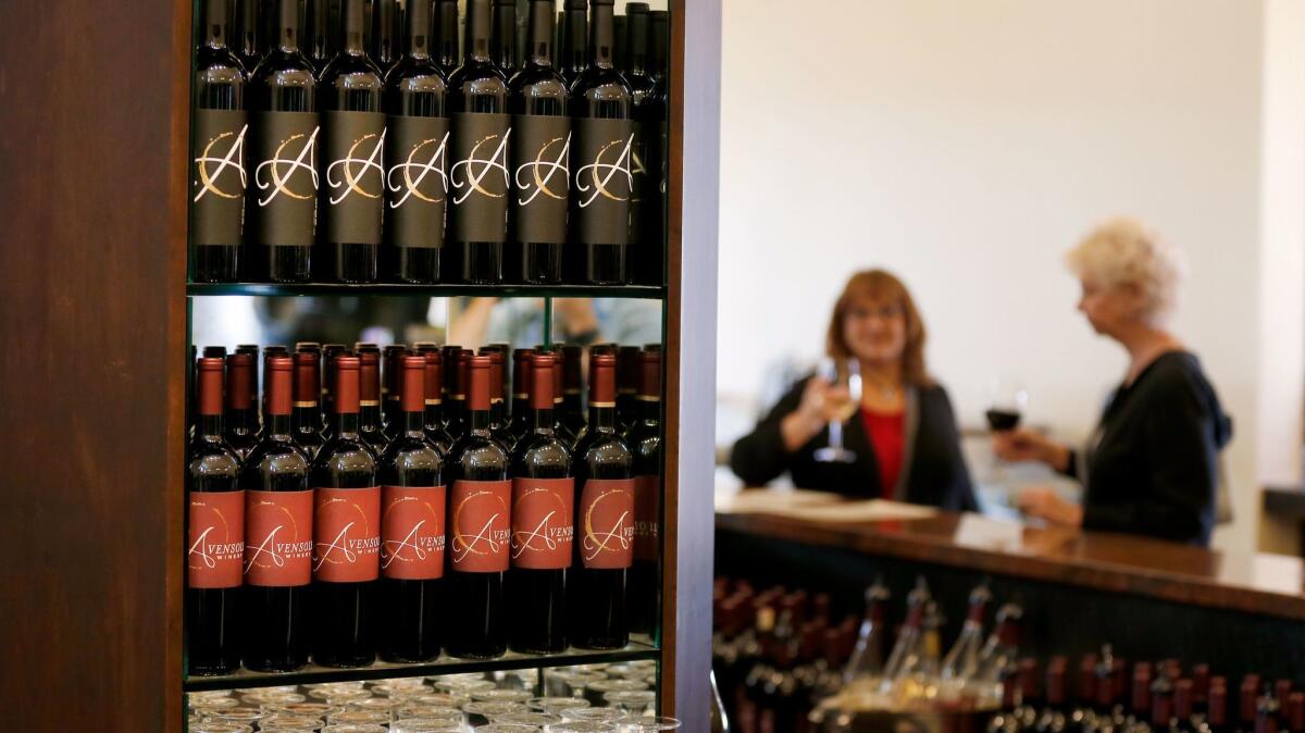 Wines on display with customers at Avensole Vineyard & Winery in Temecula. The fires in Napa and Sonoma counties in October may bring new attention and business to the Temecula Valley wine region, industry experts say.