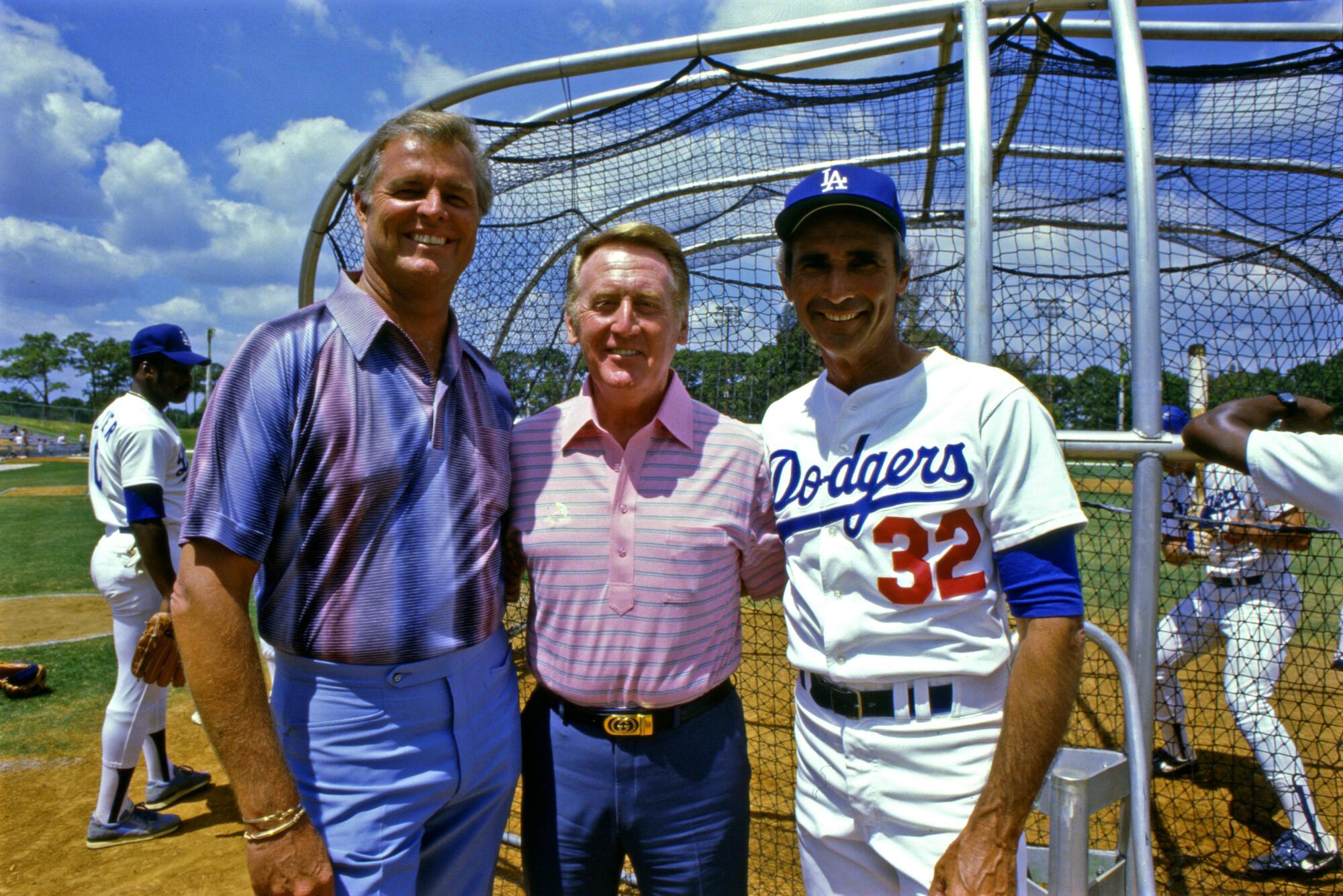 Dodgers announcer Vin Scully, center, poses for a photo with legendary Dodgers pitcher Don Drysdale and Sandy Koufax.