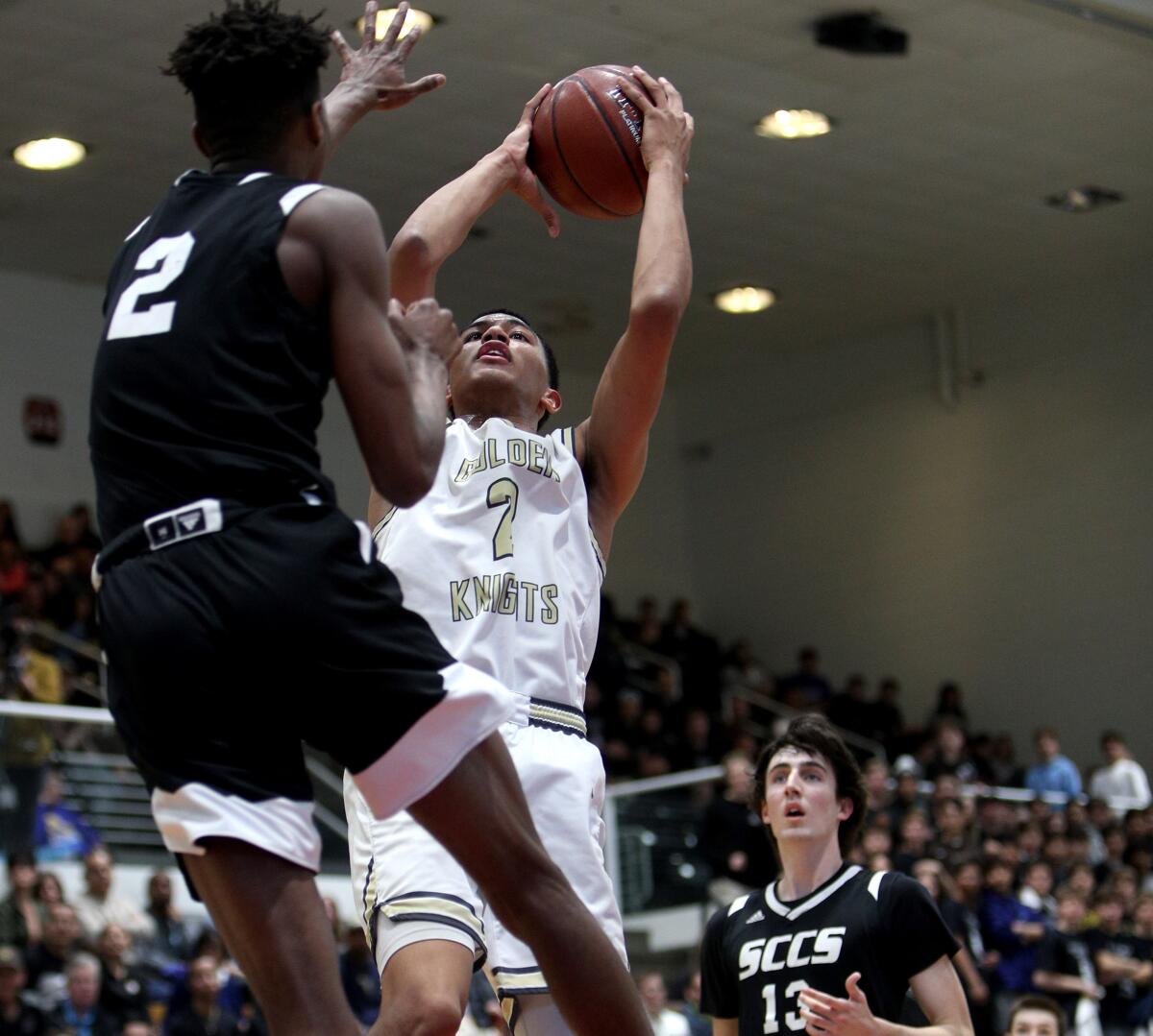 St. Francis' Andre Henry takes a shot under pressure from Santa Clarita Christian's Josh O'Garro during the Southern Section Division 2AA championship game on Feb. 29, 2020, at Azusa Pacific University.