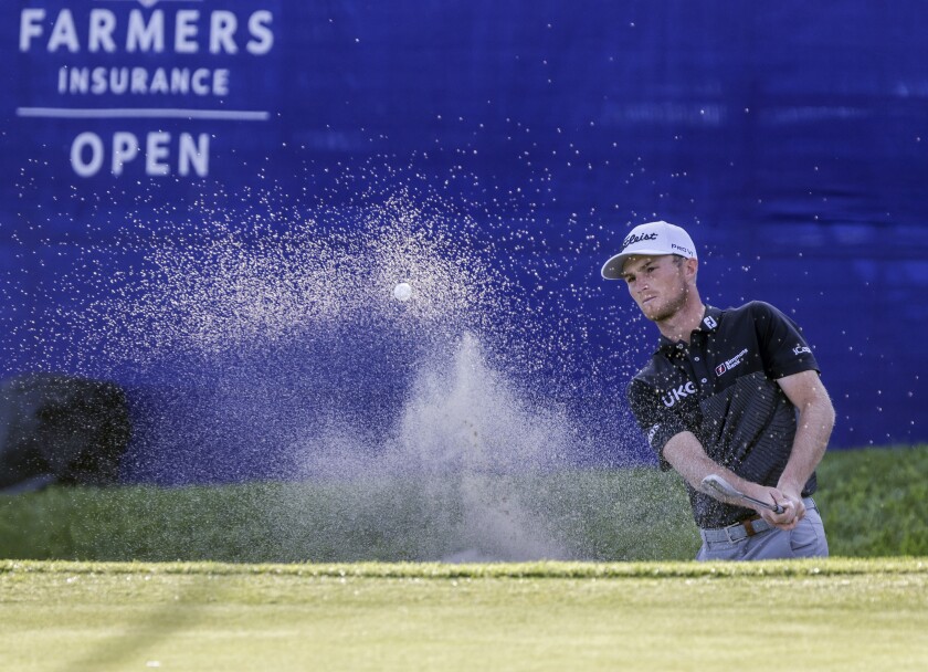 Will Zalatoris hits out of a bunker to save par at the 18th hole and take the co-lead at the Farmers Insurance Open.