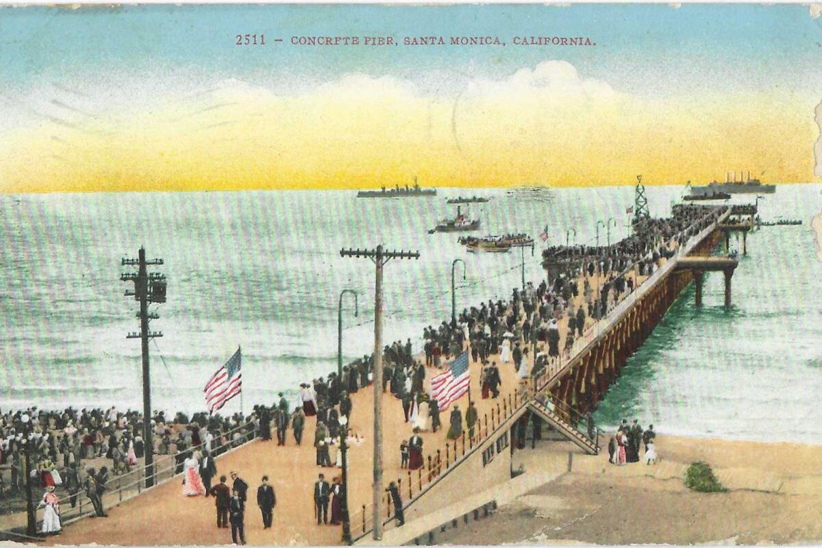 Postcard shows people on a pier with American flags. Text: "Concrete Pier, Santa Monica, California."