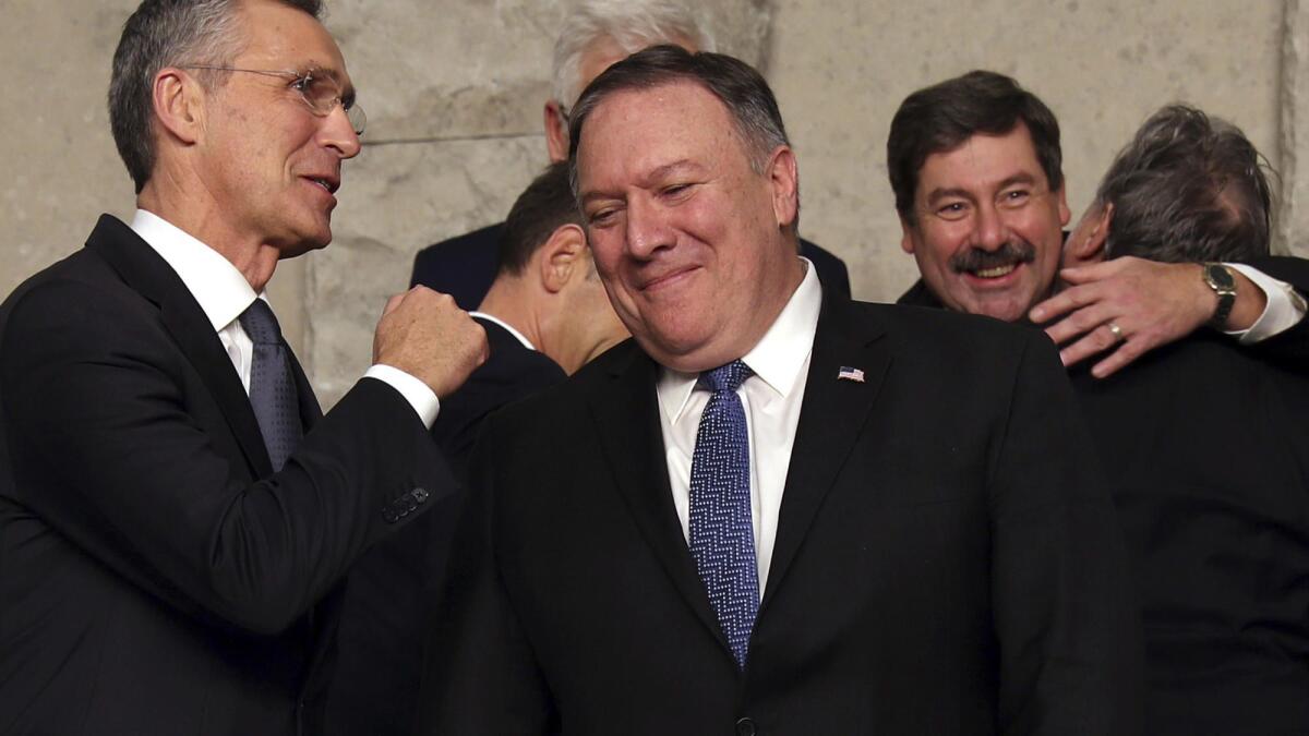 Secretary of State Michael R. Pompeo speaks with NATO Secretary-General Jens Stoltenberg in Brussels on Dec. 4.