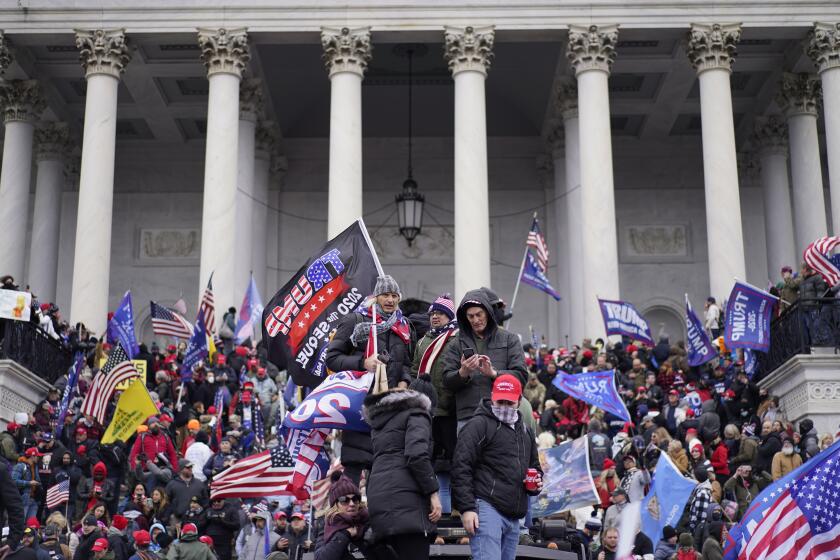 WASHINGTON, DC - JANUARY 06: Protesters gather storm the Capitol and halt a joint session of the 117th Congress on Wednesday, Jan. 6, 2021 in Washington, DC. (Kent Nishimura / Los Angeles Times)