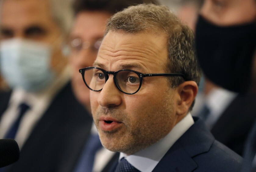 FILE - Former Lebanese Foreign Minister Gebran Bassil, speaks to journalists at the presidential palace, in Baabda east of Beirut, Lebanon, Oct. 22, 2020. Bassil who heads the Free Patriotic Movement, Lebanon’s largest Christian party, said Sunday, Jan. 2, 2022, that a 15-year-old alliance with the country's powerful Shiite group Hezbollah was no longer working and must evolve. (AP Photo/Hussein Malla, File)