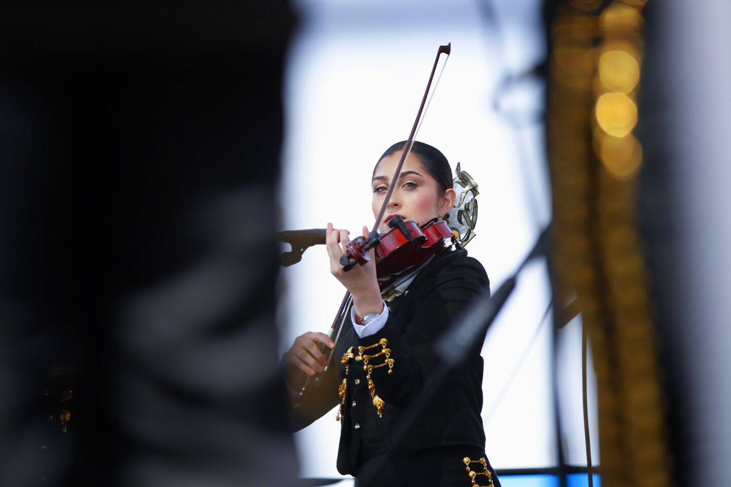 One of the violinist from the Mariachi Estrellas de Chula Vista plays during a solo performance. She and the group were performing on Sunday at the annual International Mariachi Festival in National City.