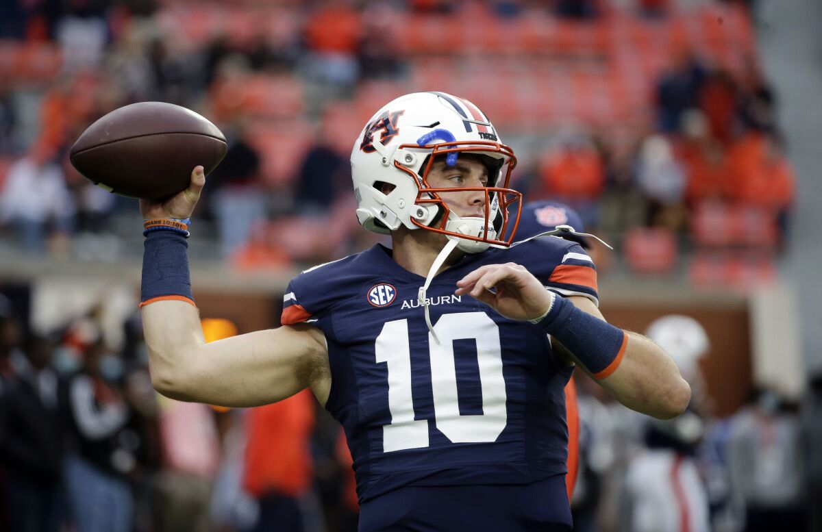 Auburn quarterback Bo Nix warms up for the team's NCAA college football game against Mississippi on Saturday, Oct. 30, 2021 in Auburn, Ala. (AP Photo/Butch Dill)
