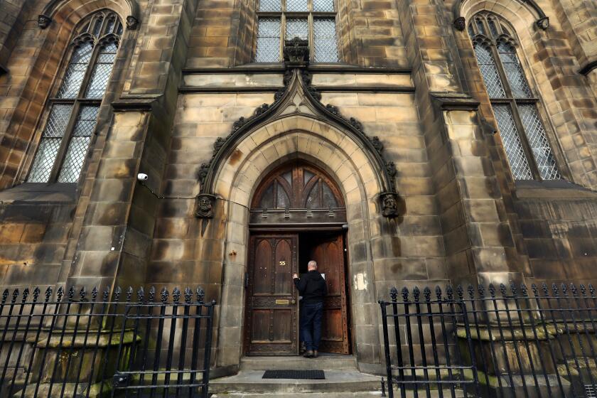 EDINBURGH, SCOTLAND-Nov. 3, 2023-John Dalton, age 39, was placed in a converted historic church along with a castle as temporary housing before recently getting an apartment of his own provided by the government. (Carolyn Cole/Los Angeles Times)
