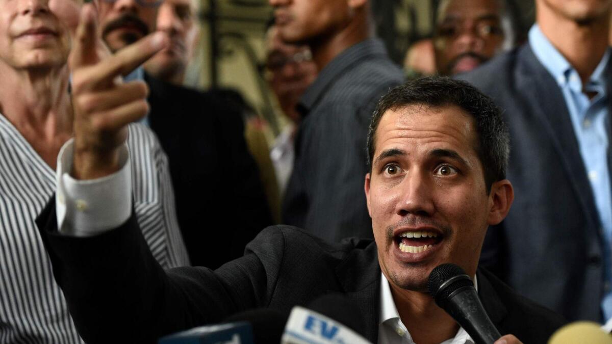 Venezuelan opposition leader and self-proclaimed acting President Juan Guaido speaks at a news conference in Caracas on Tuesday.
